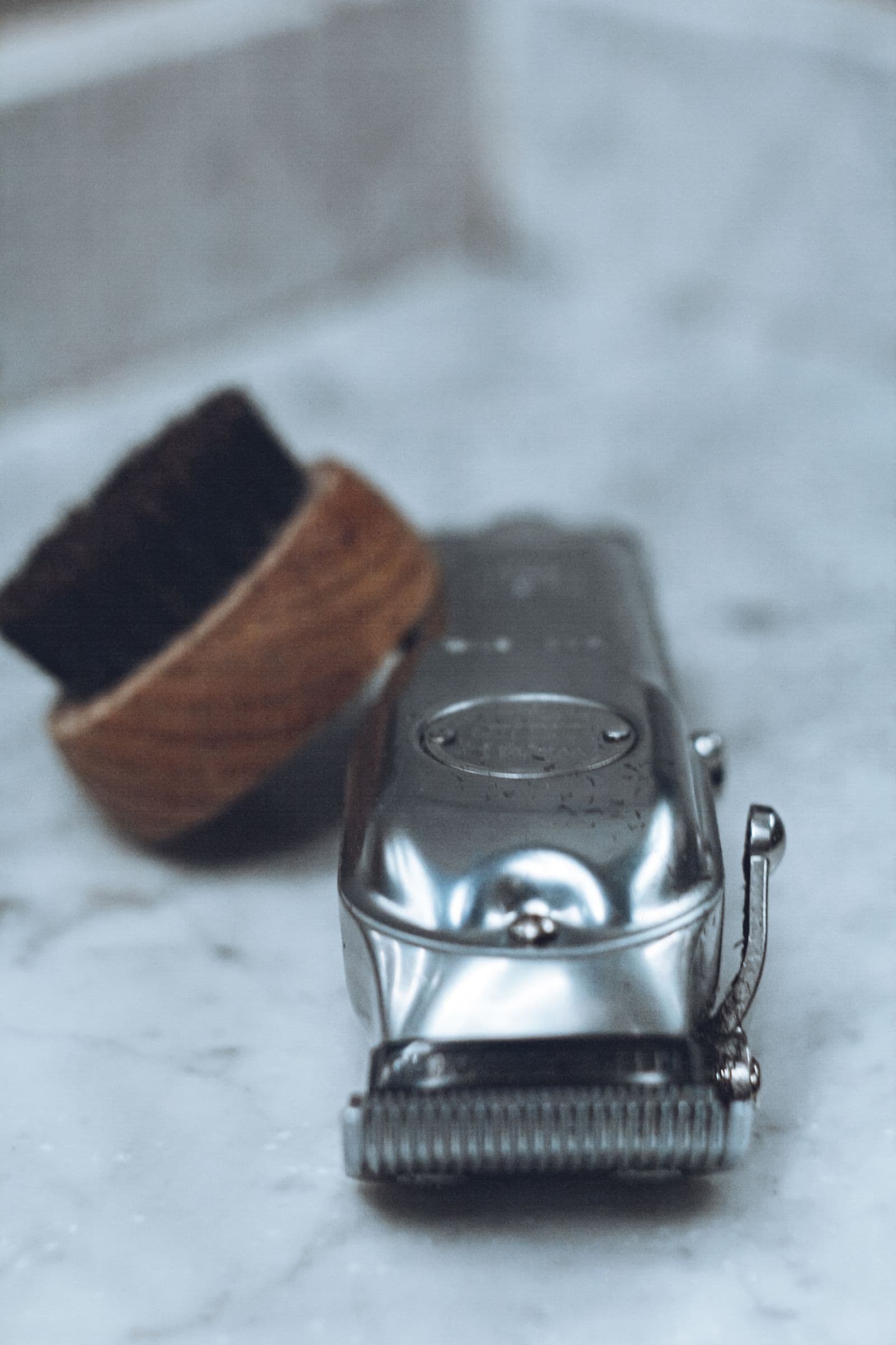 Straight razors and shaving tools laid out on the counter