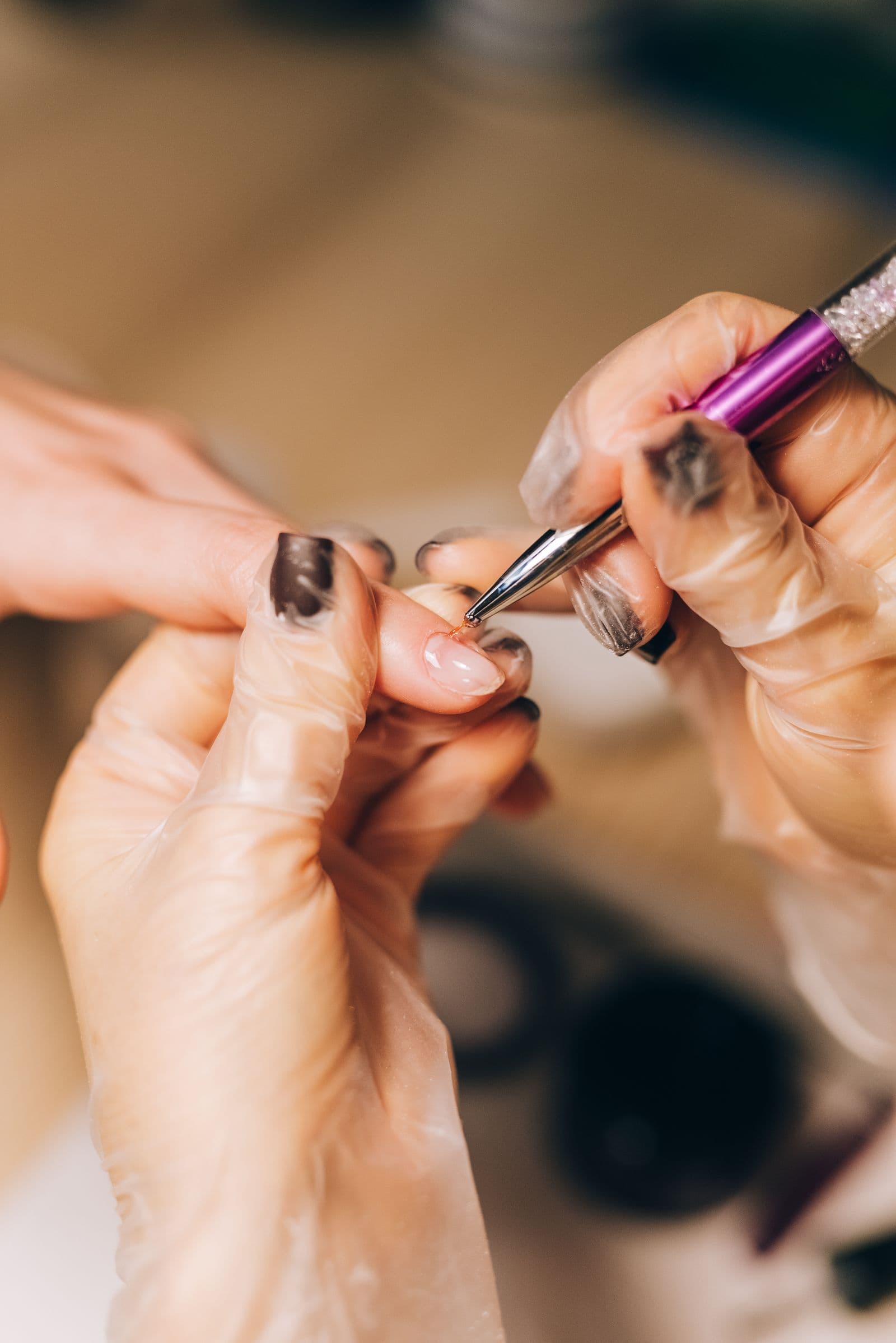 An artist hand-painting fine linework