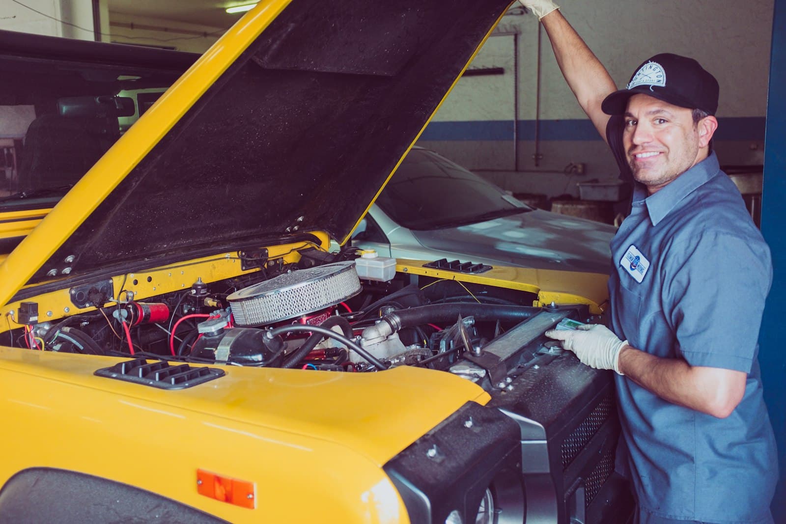 Technician working under a vehicle