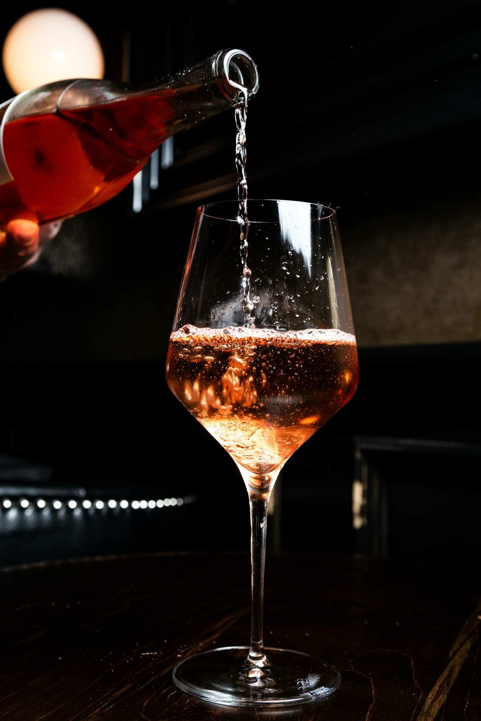 Rosé being poured into a glass
