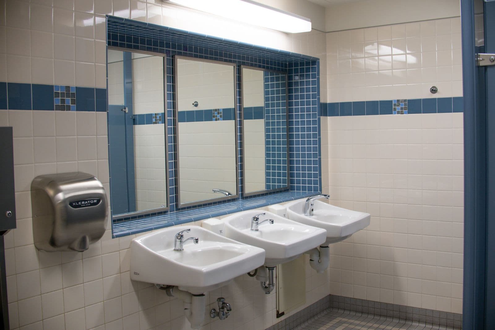 Clean, freshly installed faucet and tidy sink area after a ClearPlumbing service call