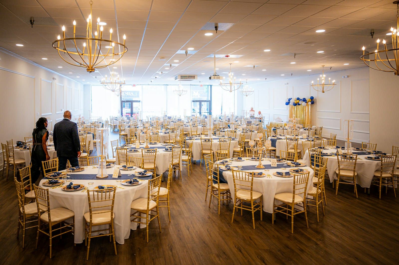 Banquet hall set with round tables for a wedding reception