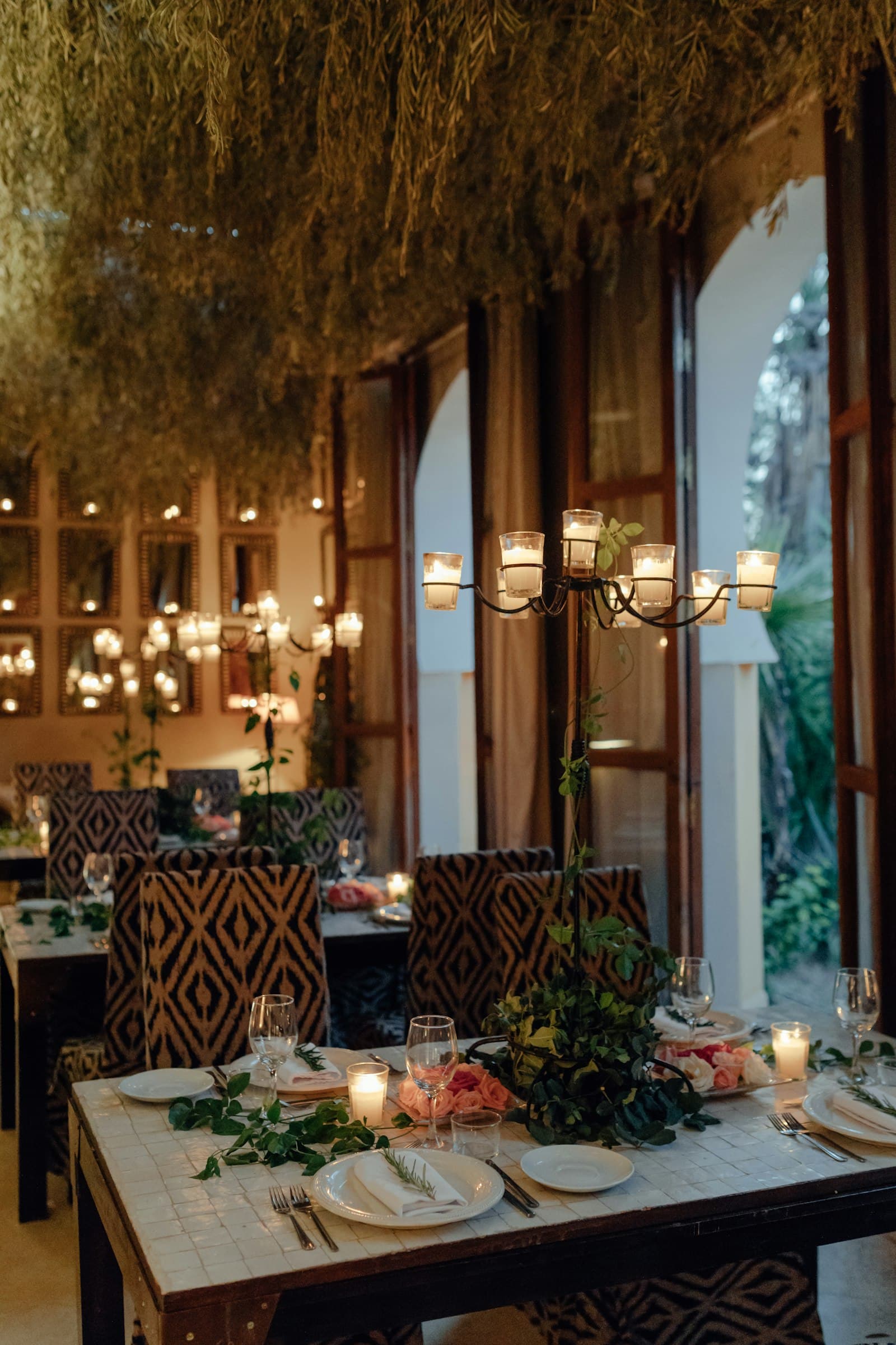 The candlelit dining room of The Gurkha House at night