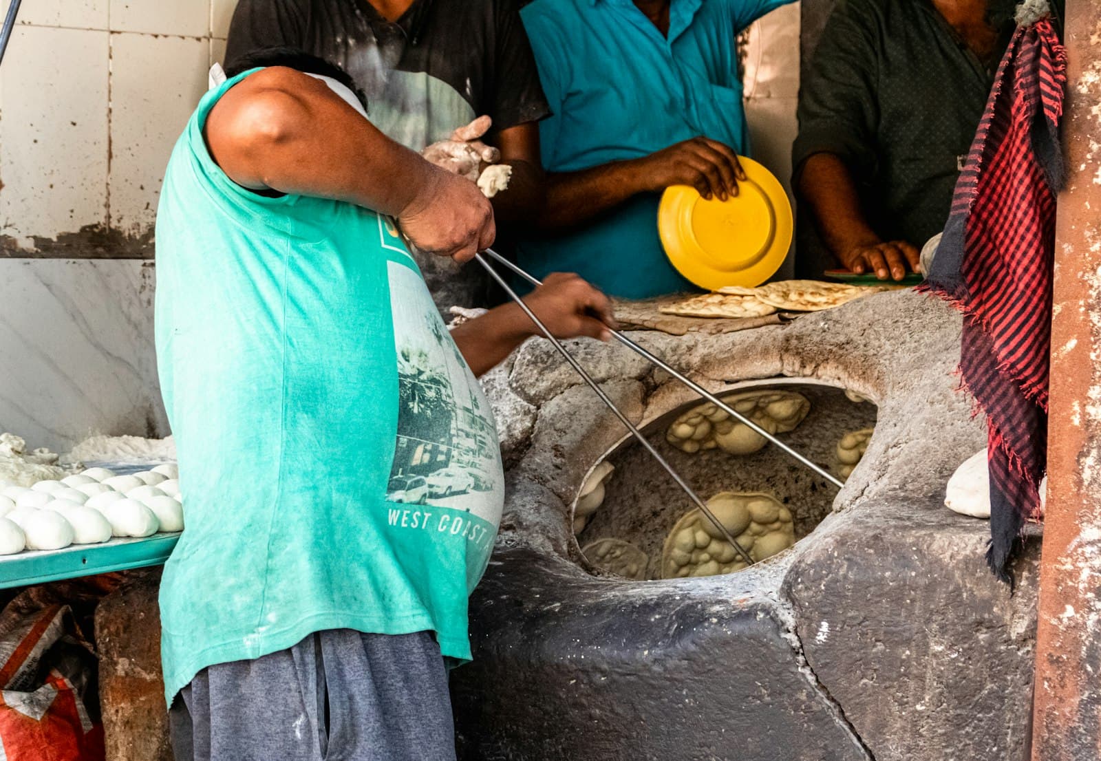 The clay tandoor glowing in the Saffron kitchen