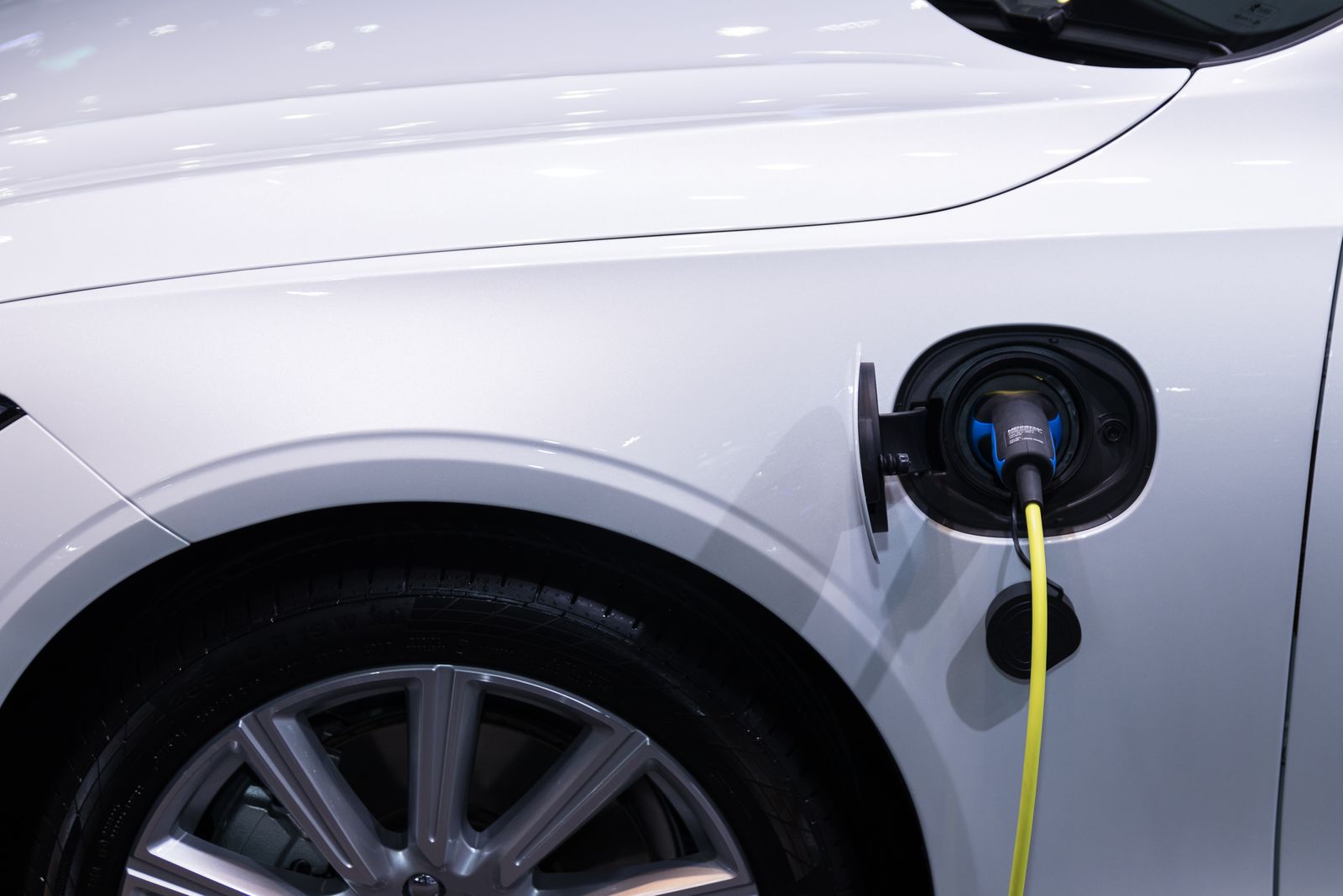 Electric vehicle on a lift in the Voltworks high-voltage service bay